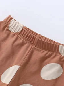 Girl's fleece-lined brown polka dot pants with comfortable elasticated waistband detail