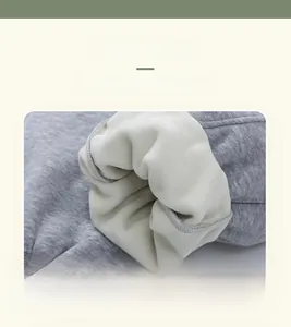 Macro detail of warm fleece lining and soft grey knit fabric for children's pants