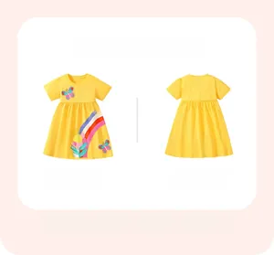 Detail of yellow cotton dress for girls with rainbow and butterfly embroidery