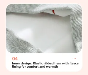 Detail of elastic ribbed hem and warm white fleece lining on the grey winter hoodie