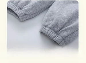 Close-up of gray knit jogger cuffs with thick fleece lining and ribbed ankle design