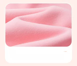 Close-up of soft pink knit fabric texture for girls' long sleeve cotton sweatshirt