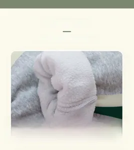 Detail view of boys thick winter pants showing gray knit fabric and warm white fleece lining