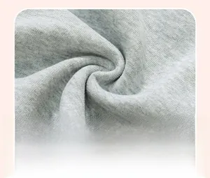 Close-up of grey marl cotton knit fabric showing soft texture and folded draping