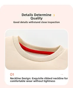 Detail of ribbed crew neck on beige cotton sweatshirt with red contrast inner lining
