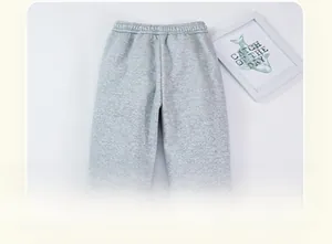 Detail view of the back design and elastic waistband on thick grey fleece trousers