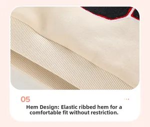 Detailed close-up of ribbed elastic hem on kids long sleeve fleece sweatshirt in beige