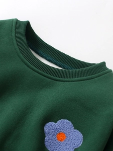 Dark green girl's sweatshirt featuring a round neck and detailed blue flower embroidery