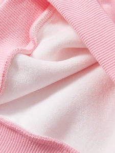 Pink long sleeve sweatshirt with soft white fleece lining and ribbed knit cuffs