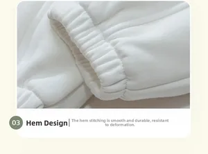 Detail view of elastic ribbed cuffs on thick thermal white joggers for boys