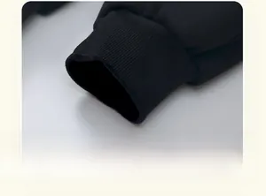 Detail of black children's fleece pants showing durable ribbed ankle cuffs for warmth