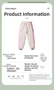 Detail of fleece-lined beige kids pants showing size chart and fabric composition label