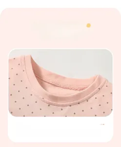 Detail of pink cotton baby t-shirt featuring ribbed neckline and double-needle stitching