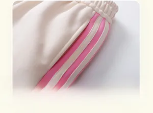 Detailed close-up of elastic waistband with pink stripes on toddler fleece pants