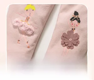 Detailed view of pink leggings featuring ballet dancer prints and 3D tassel tutu decorations