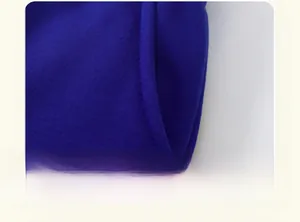 Detailed close-up of high-quality sewing and stitching on warm winter fleece kids' pants