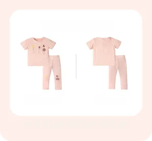Flat lay of pink girls' short sleeve t-shirt and pants set with ballerina print