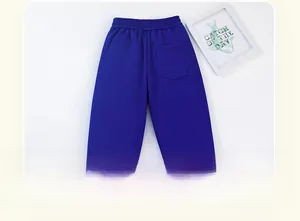 Detail of navy blue fleece-lined kids' joggers showing elastic waistband and back pocket