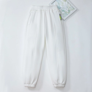 Fleece-lined white joggers for kids with elastic waist and side ribbon detail