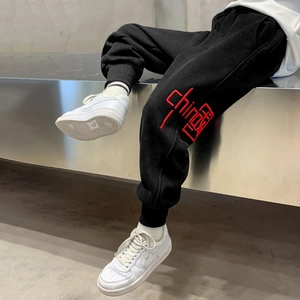 Thick warm black children's joggers with red China embroidery and ribbed cuffs