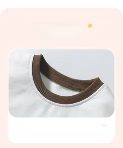 Detail of contrast brown ribbed neckline on white cotton t-shirt with reinforced stitching