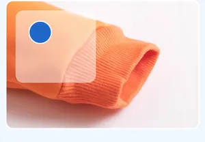 Detailed close-up of bright orange ribbed cuffs on children's thick cotton jacket