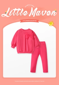 Detail of rose red girls' tracksuit with a soft tulle bow and ribbed cotton cuffs