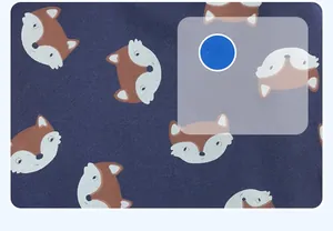 Detail of fox print on dark navy cotton knit fabric for children's winter jackets
