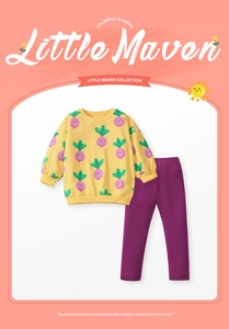 Detail of girls yellow sweatshirt with radish pattern and purple ribbed pants for ages 2-7