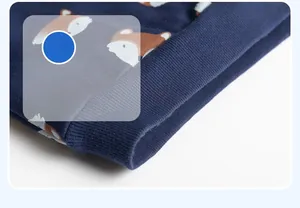 Detail view of ribbed hem and fox print on dark blue cotton knit sweatshirt for kids