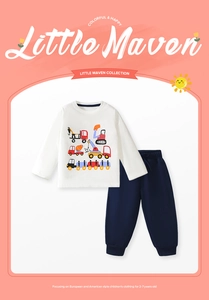 Detail view of cotton toddler tracksuit featuring colorful cartoon construction vehicle prints