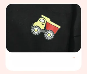 Close-up of a high-quality yellow dump truck print on black cotton kids hoodie fabric