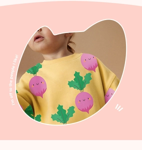 Detail of yellow cotton sweatshirt with cute purple beet prints for little girls