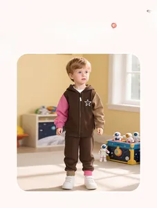 Detail of kids two-piece tracksuit with contrast sleeves and white star embroidery