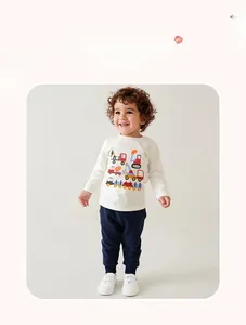 Detail showing white long sleeve toddler shirt with colorful cartoon excavator print
