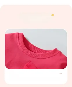 Close-up of rose pink girls sweatshirt rib-knit crewneck with reinforced stitching detail