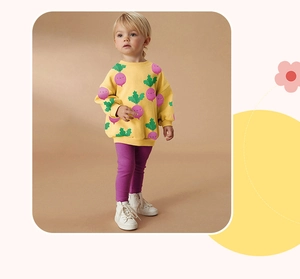 Detail of girls yellow long sleeve sweatshirt with purple turnip prints and leggings