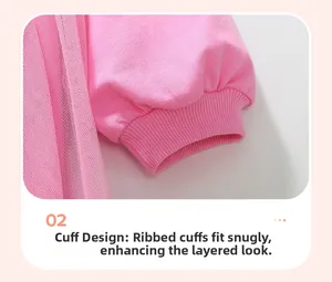 Detail of pink ribbed cuffs and layered tulle fabric on this girls cotton dress