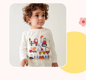 Detail of boys long sleeve cotton t-shirt with colorful cartoon construction vehicle prints