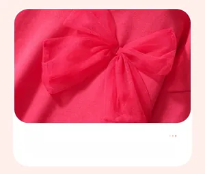 Detail of rose red cotton sweatshirt featuring a lightweight 3D mesh bow decoration