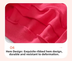 Detailed close-up of ribbed hemline on girls' pink cotton sweatshirt for durability