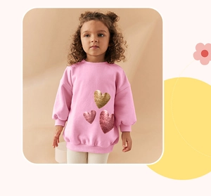 Detail of pink long-sleeve sweatshirt for girls with three sequin heart patterns
