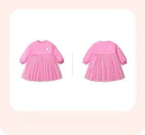 Detail view of pink long sleeve girl dress with white rabbit embroidery and tulle skirt