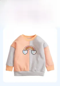 Detailed view of rainbow sequin patch and mixed-color stitching on kids cotton sweatshirt