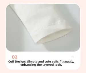 Close-up of boys' white cotton long sleeve T-shirt cuffs with neat double-needle stitching