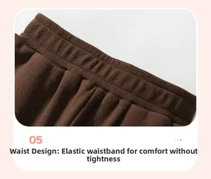 Detail view of the brown elastic ribbed waistband on kids' knit casual pants