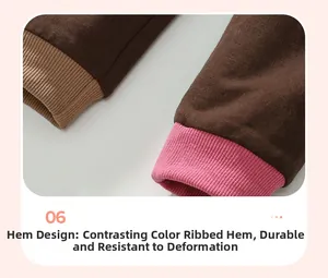 Detail of kids brown knit pants with unique pink and beige contrast ribbed ankle cuffs