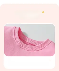 Detail view of pink cotton ribbed neckline and fine stitching on girls' sweatshirt