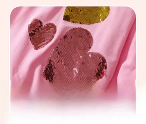 Detailed view of pink heart-shaped sequin embroidery on cotton girls sweatshirt