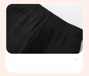 Détail de la taille en tissu côtelé noir avec bande élastique pour pantalon fille